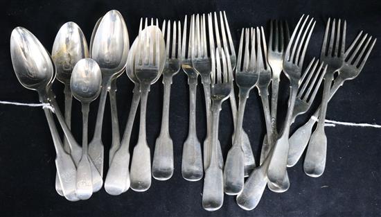 A quantity of Georgian silver fiddle pattern flatware, various dates and makers, some part sets,